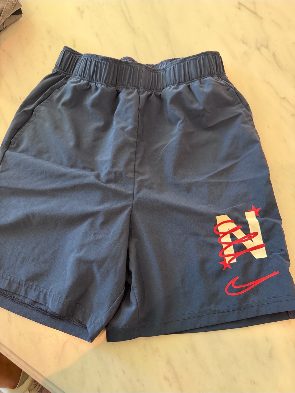 Unlined Nike Boys Navy Shorts with Red and White Logo